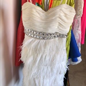 White dress with rhinestones and feathers